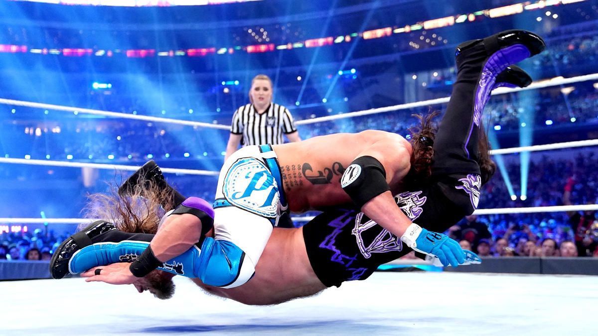 AJ Styles planting Edge with a Styles Clash