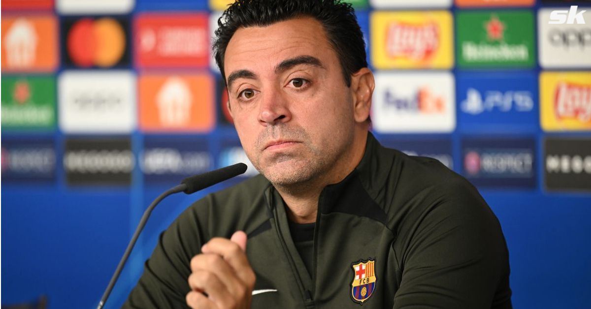 Barcelona manager Xavier Hernandez looks on.