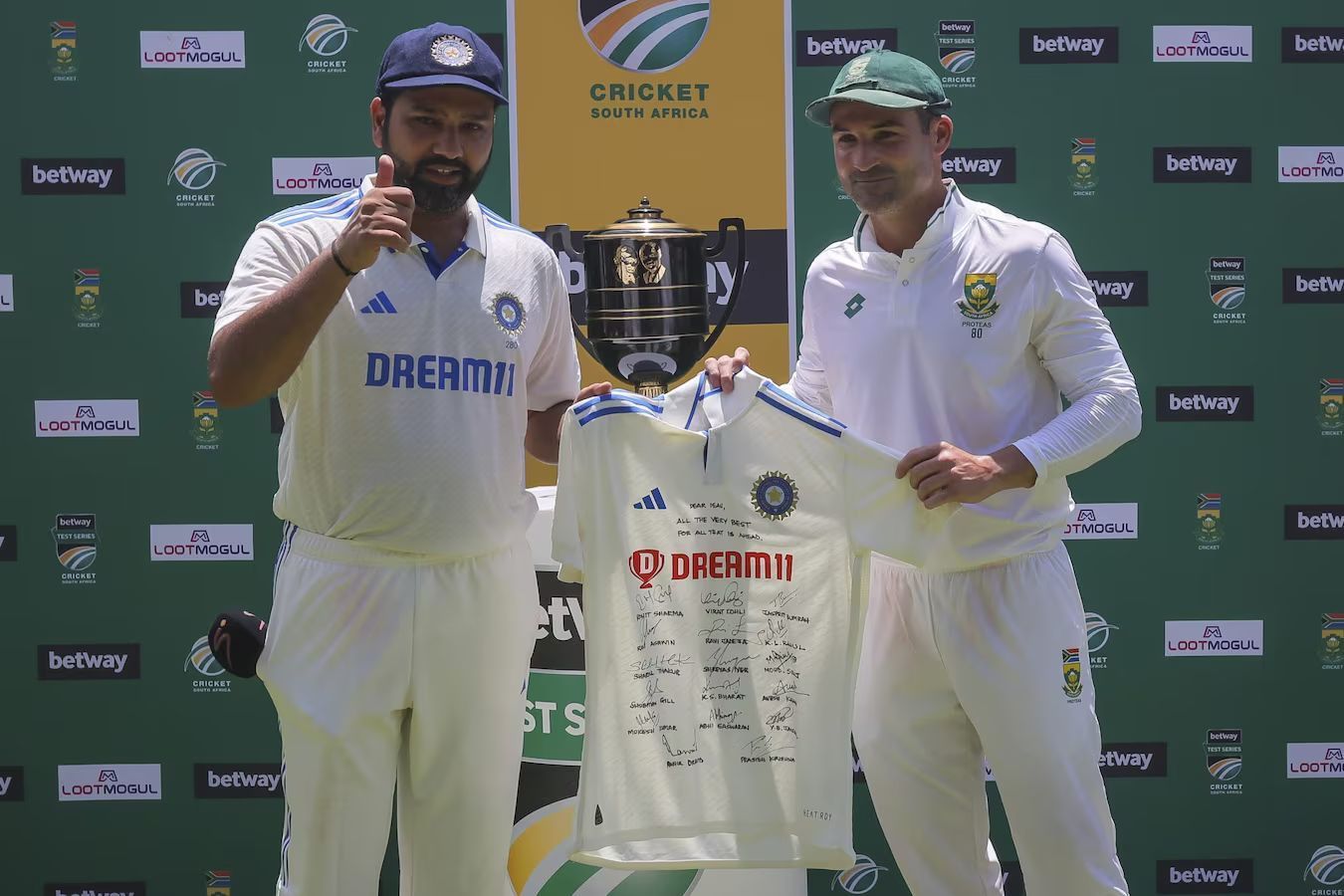 Rohit Sharma (L) and Dean Elgar.