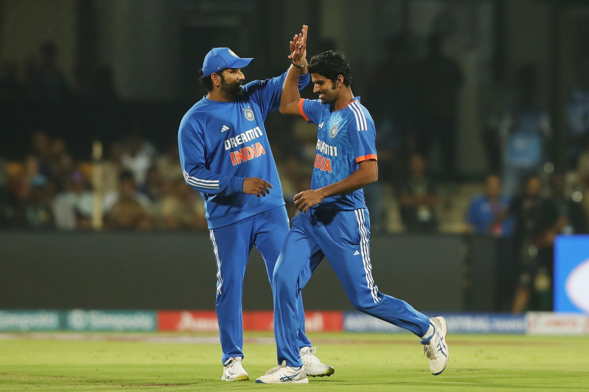 Washington Sundar [right] picked up three wickets in three overs