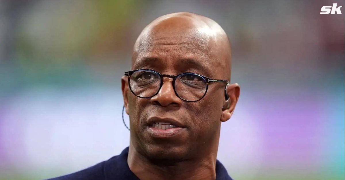 Arsenal legend Ian Wright looks on.