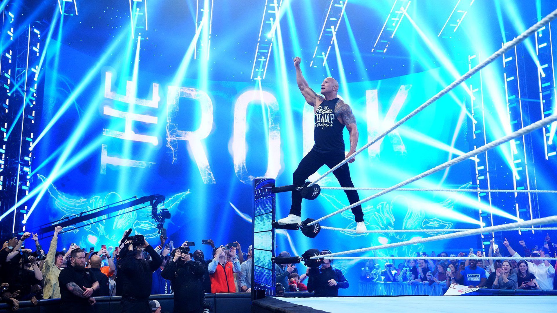 The Rock poses for the WWE Universe on SmackDown