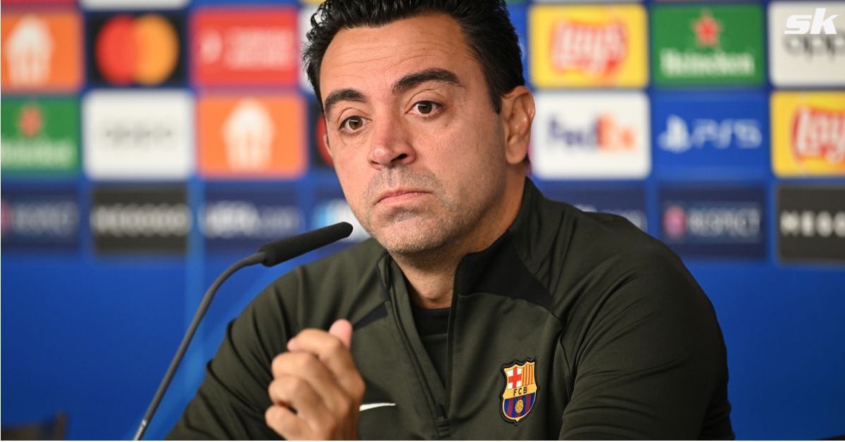 Barcelona boss Xavier Hernandez looks on.