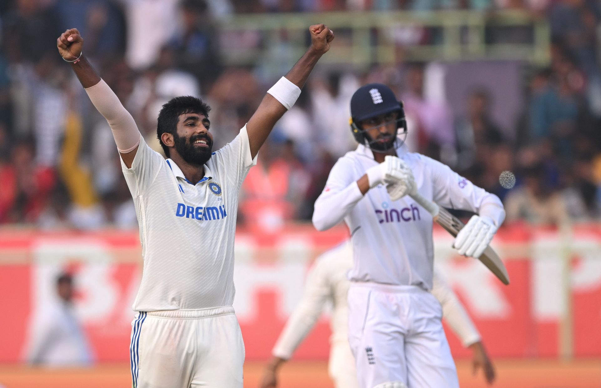 Jasprit Bumrah (left) celebrates a wicket