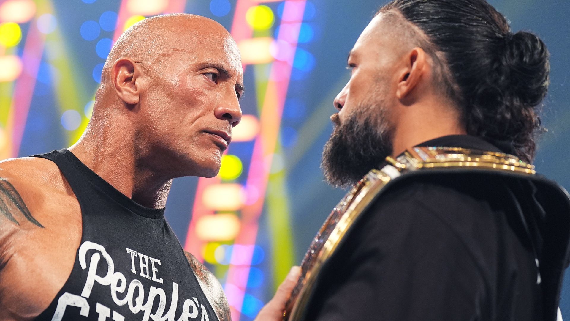 Epic stare down between The Rock and Roman Reigns.