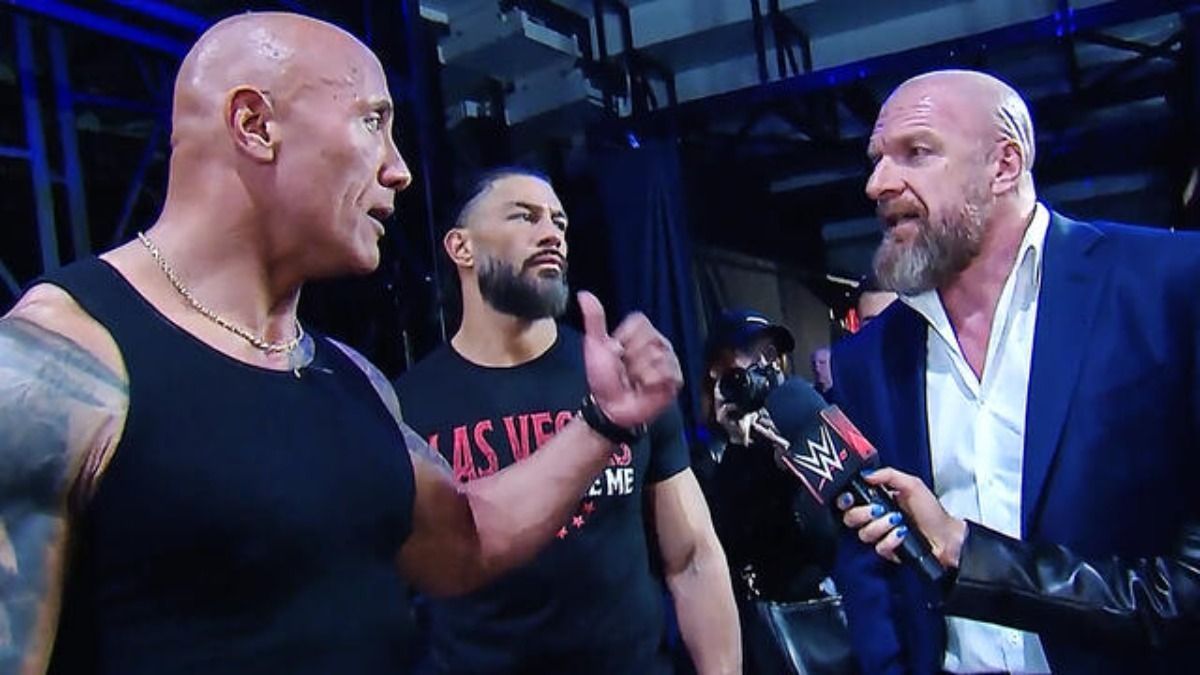 The Rock, Roman Reigns and Triple H.