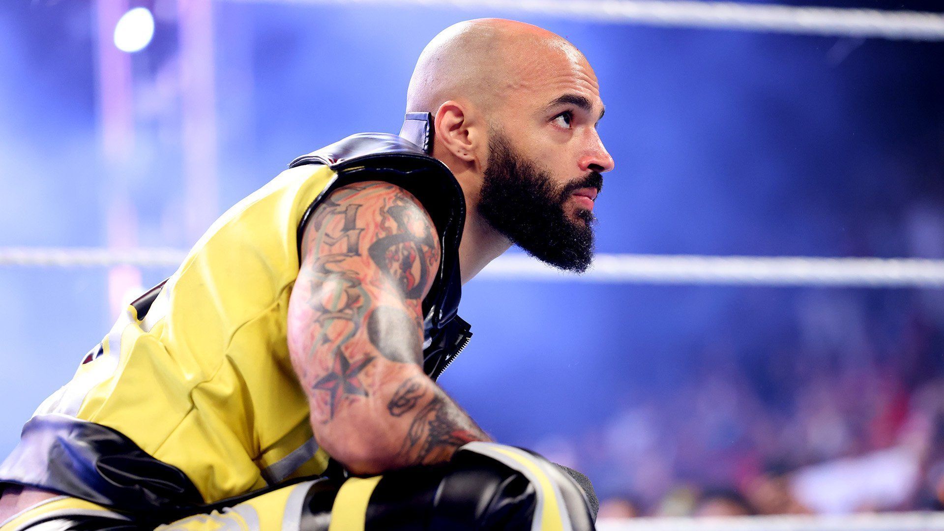 Ricochet looks on from the WWE RAW ring