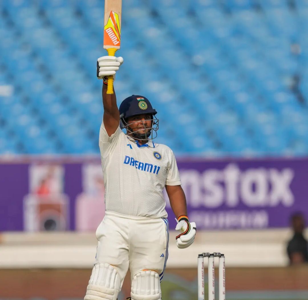 Sarfaraz Khan raising his bat after his maiden Test fifty 