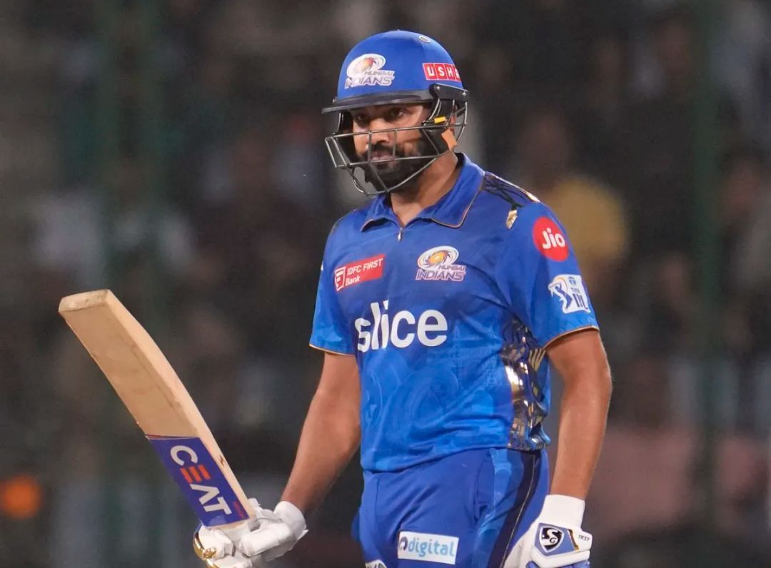 Rohit Sharma acknowledging his half-century for MI