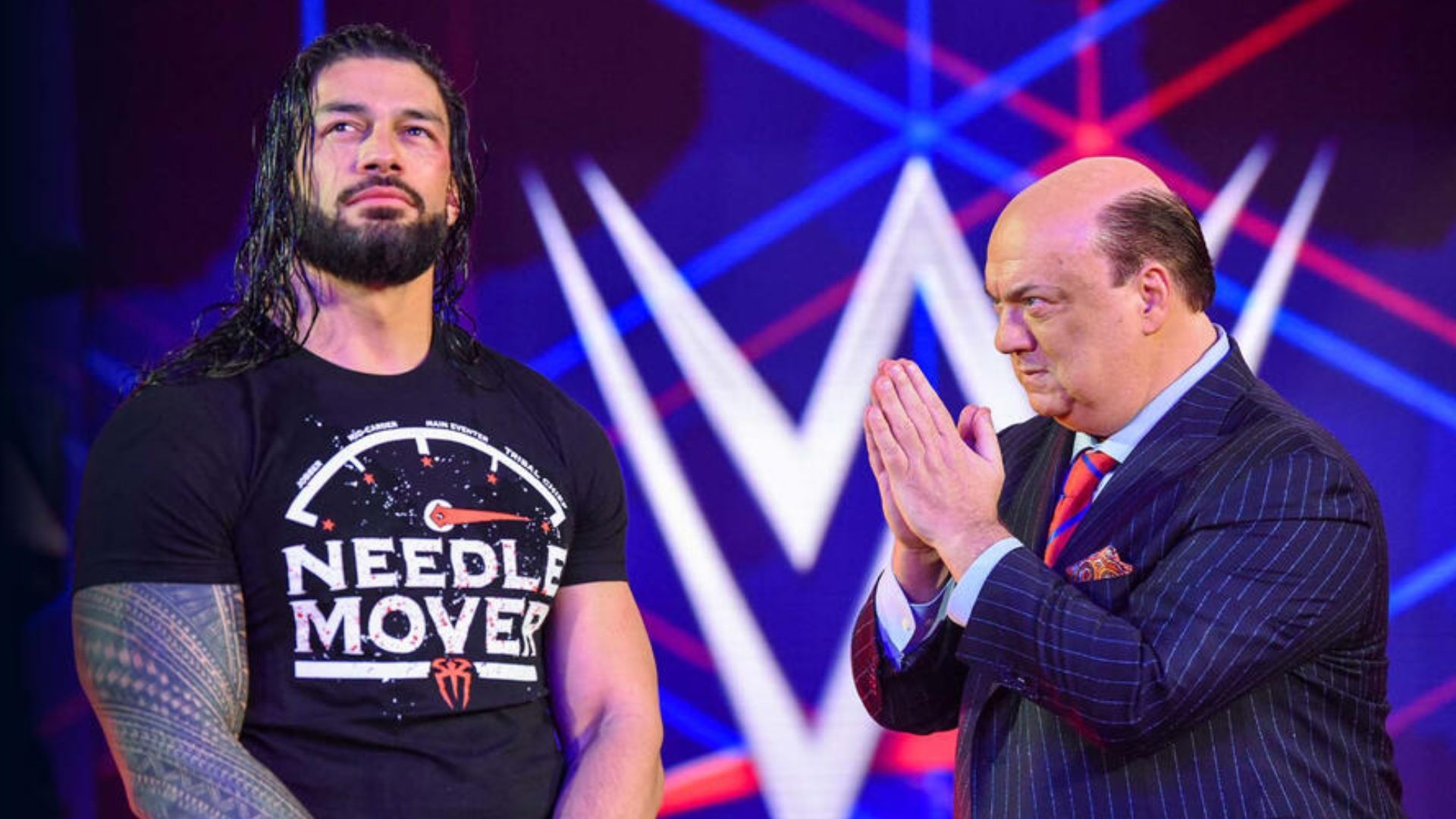 Roman Reigns (Left) and Paul Heyman