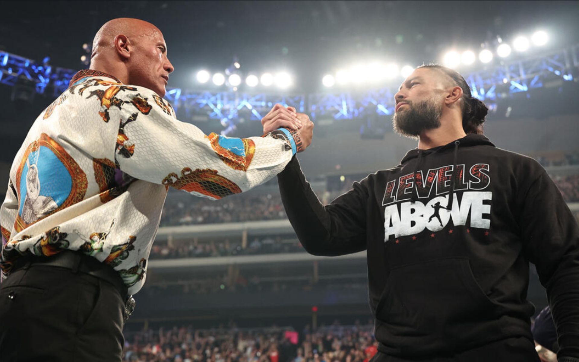 The Rock and Roman Reigns cementing their alliance on SmackDown earlier this month (Image: WWE)