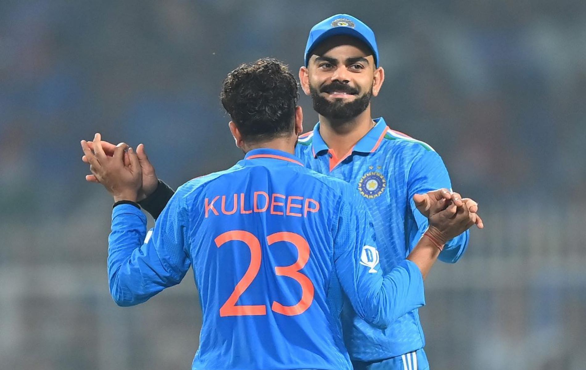 Kuldeep Yadav (L) with Virat Kohli (R).