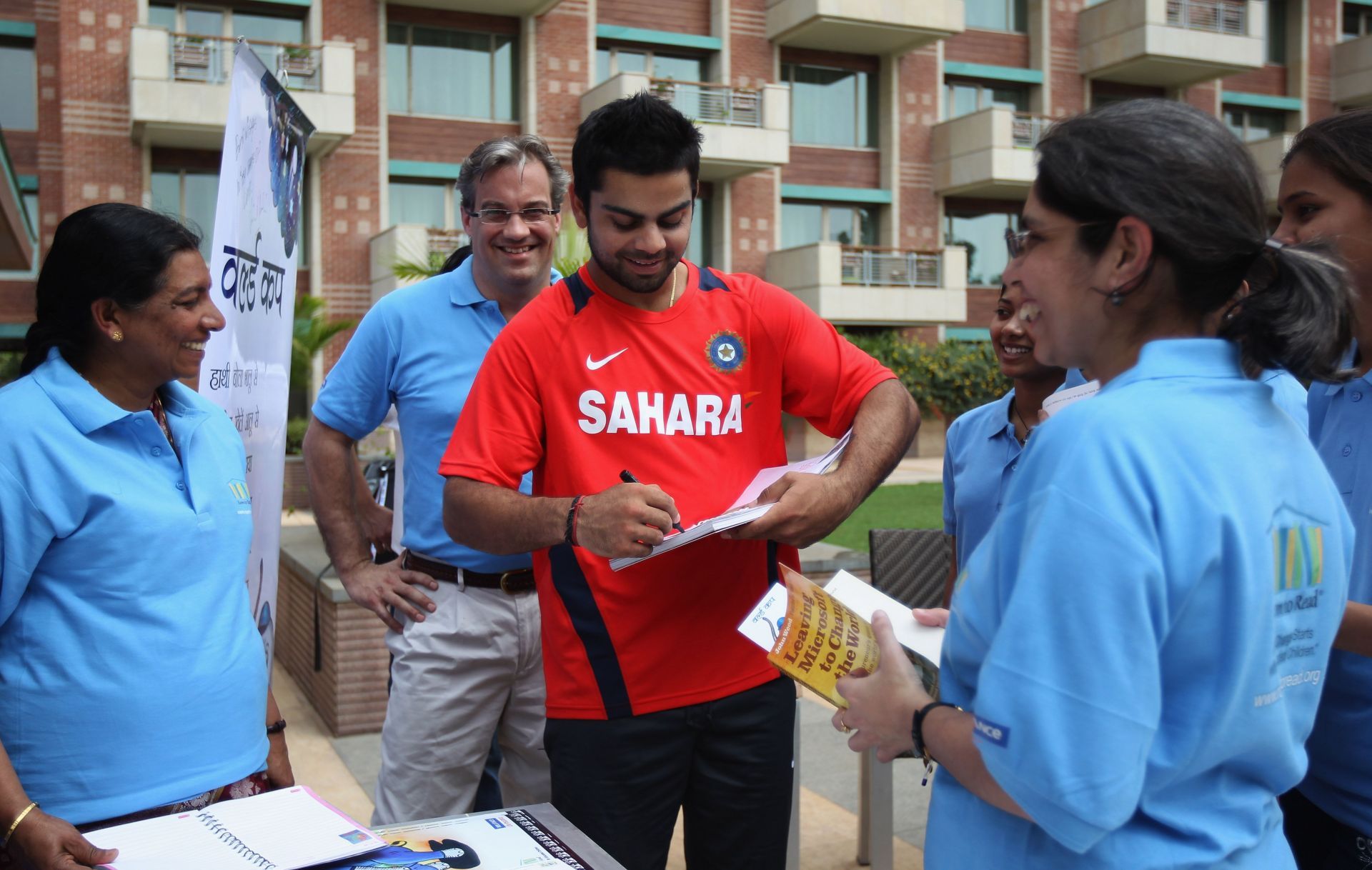 Virat Kohli interacting with fans off the field in his younger days.