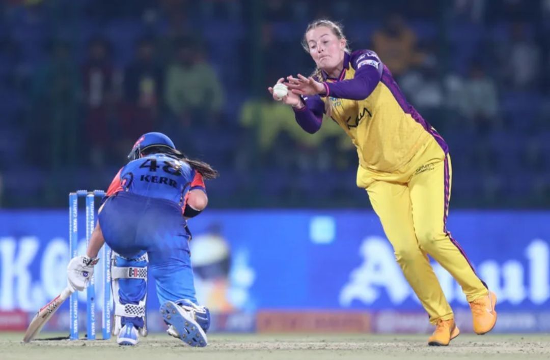 Sophie Ecclestone trying to catch a ball vs MI