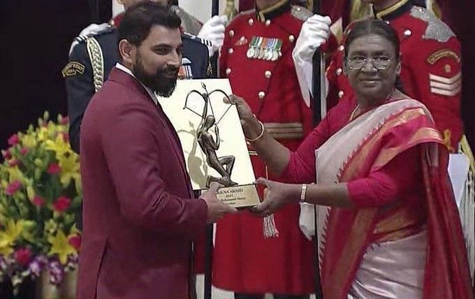 Shami receiving award