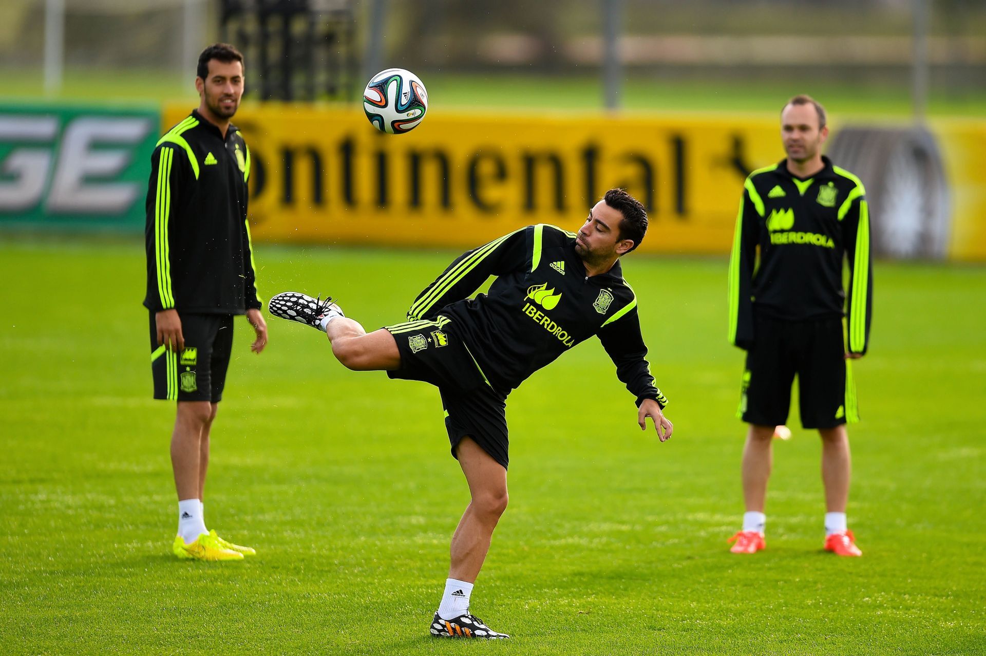 Xavi (centre) and Andres Iniesta (right)