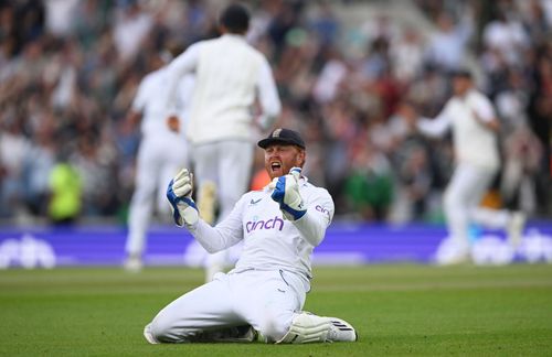 Jonny Bairstow celebrates by falling onto the ground.