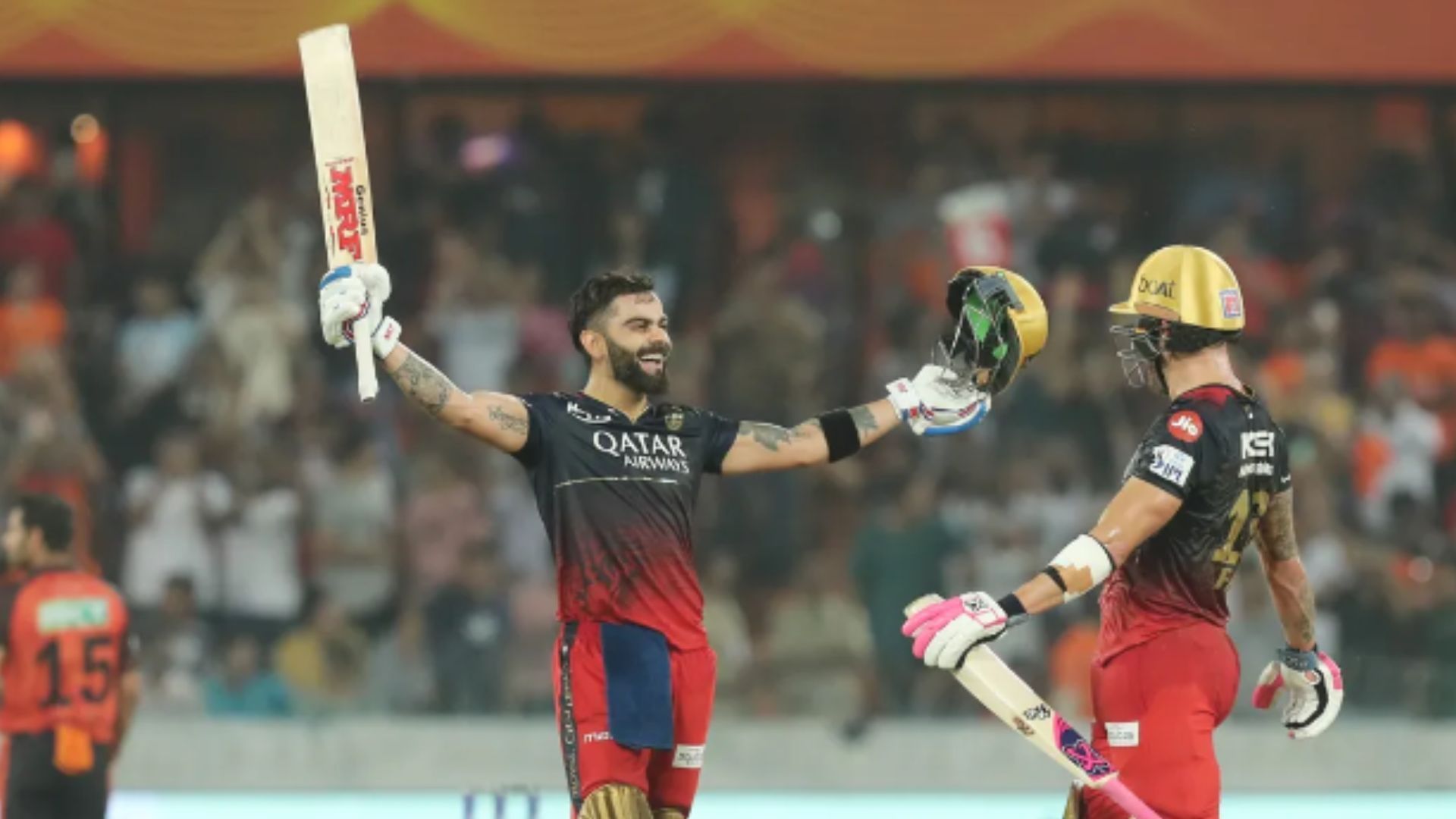 Virat Kohli celebrates scoring a century against SRH in 2023. 