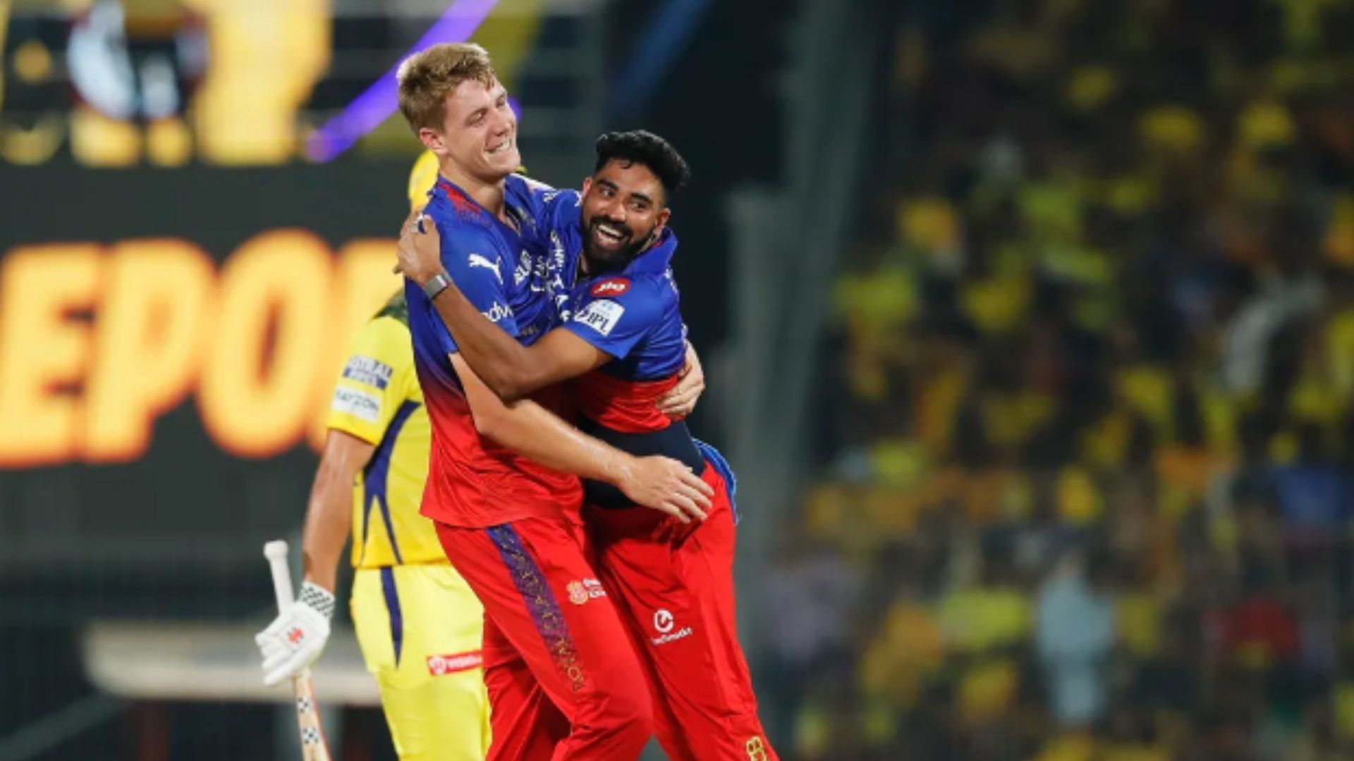 Green celebrates (L) with Mohd Siraj after picking up a wicket.