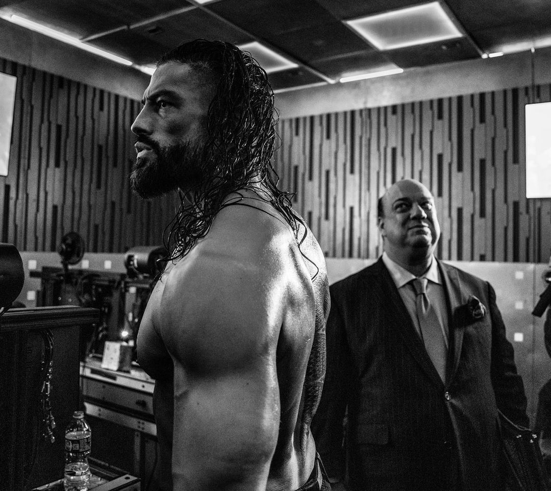 Roman Reigns backstage with Paul Heyman