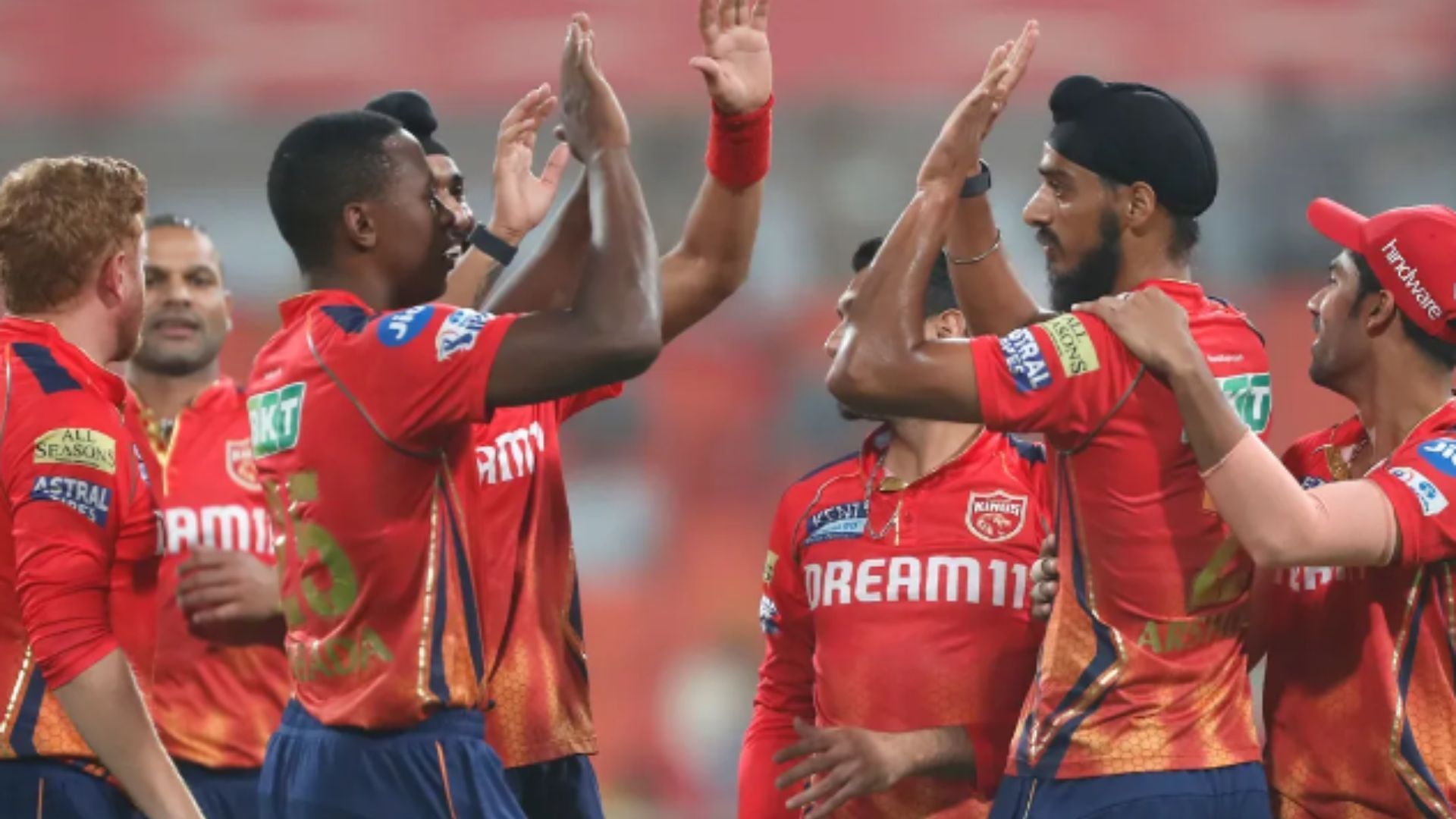 Punjab Kings celebratest picking a wicket against SRH. 