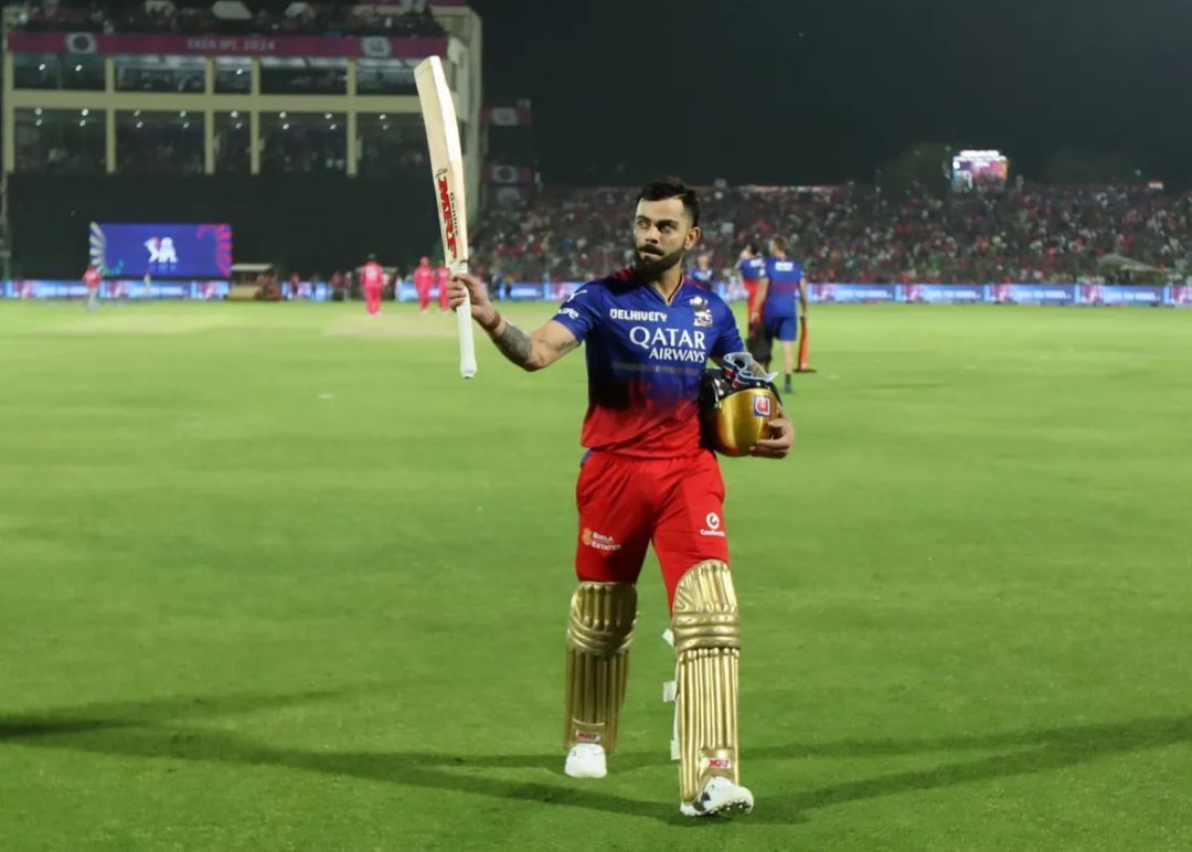 Virat Kohli heading back to the dugout after his century