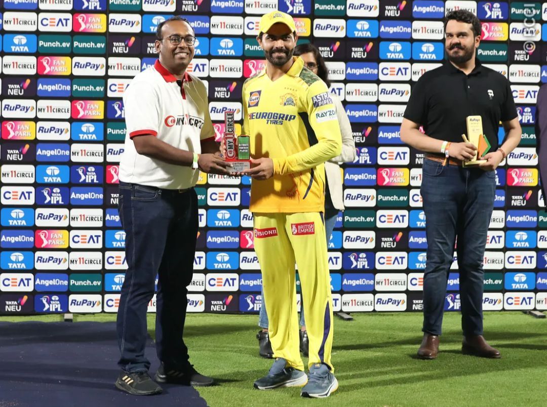 Ravindra Jadeja posing with the POTM award