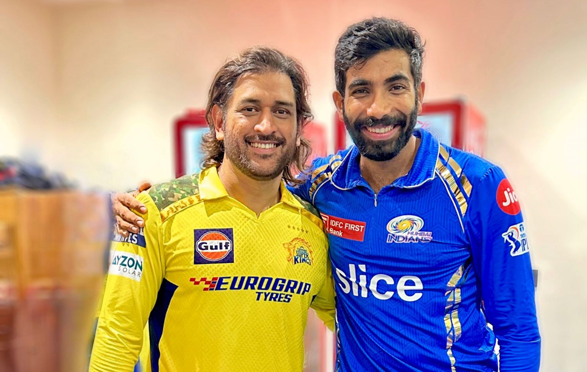 MS Dhoni posing with Jasprit Bumrah.