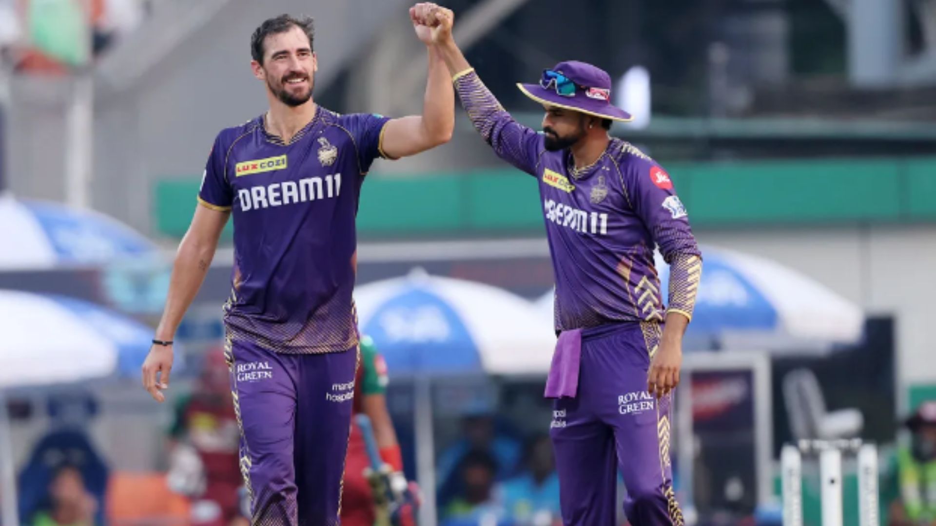 Starc celebrates picking a wicket with his captain Shreyas Iyer against LSG.