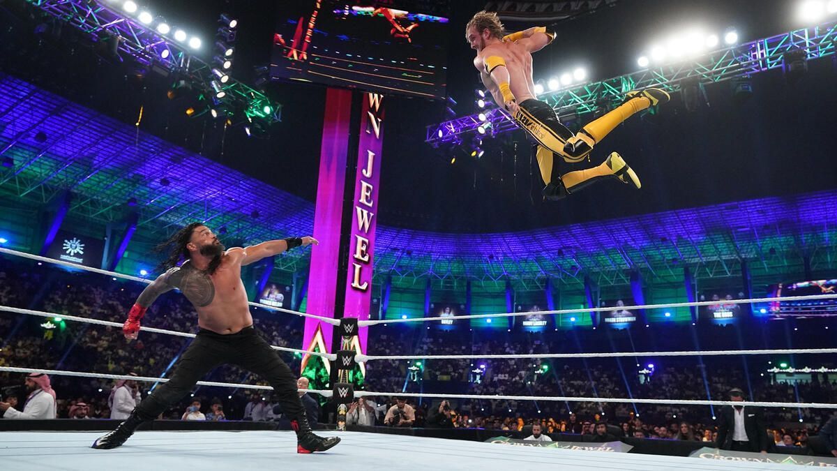 Logan Paul hits Roman Reigns with his version of the latter's Superman Punch at Crown Jewel 2022