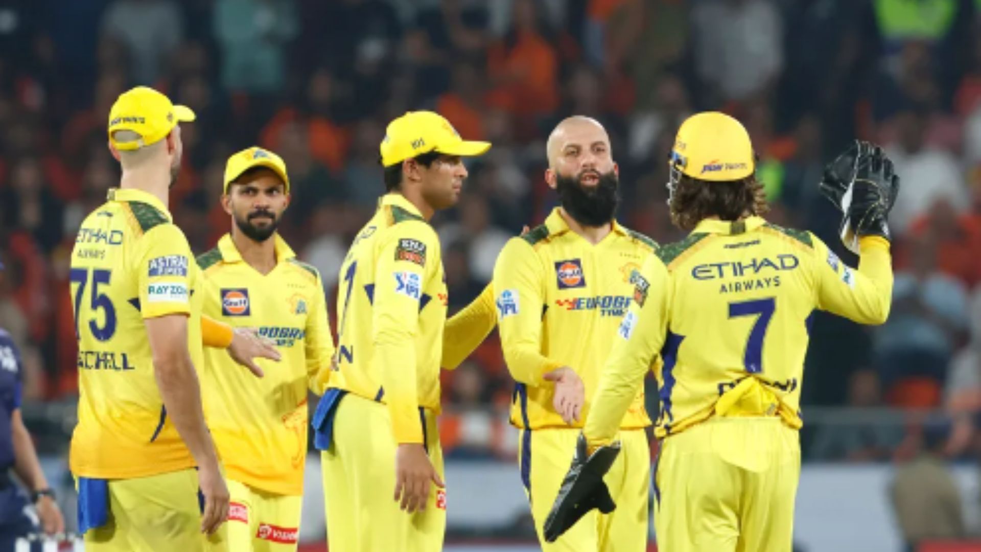 Moeen Ali celebrates with teammates after picking a wicket against SRH. 