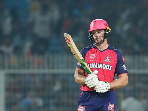 Jos Buttler looking at his bat during the IPL 2024 match vs KKR