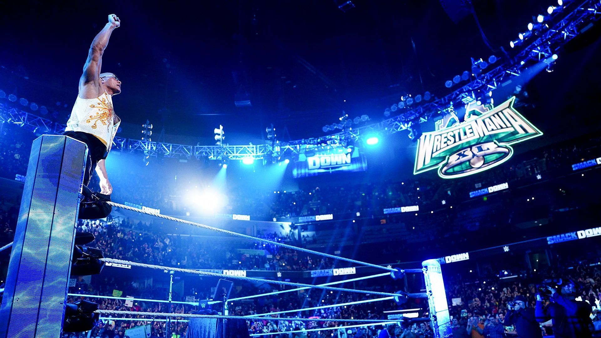 The Rock poses for the WWE Universe on SmackDown