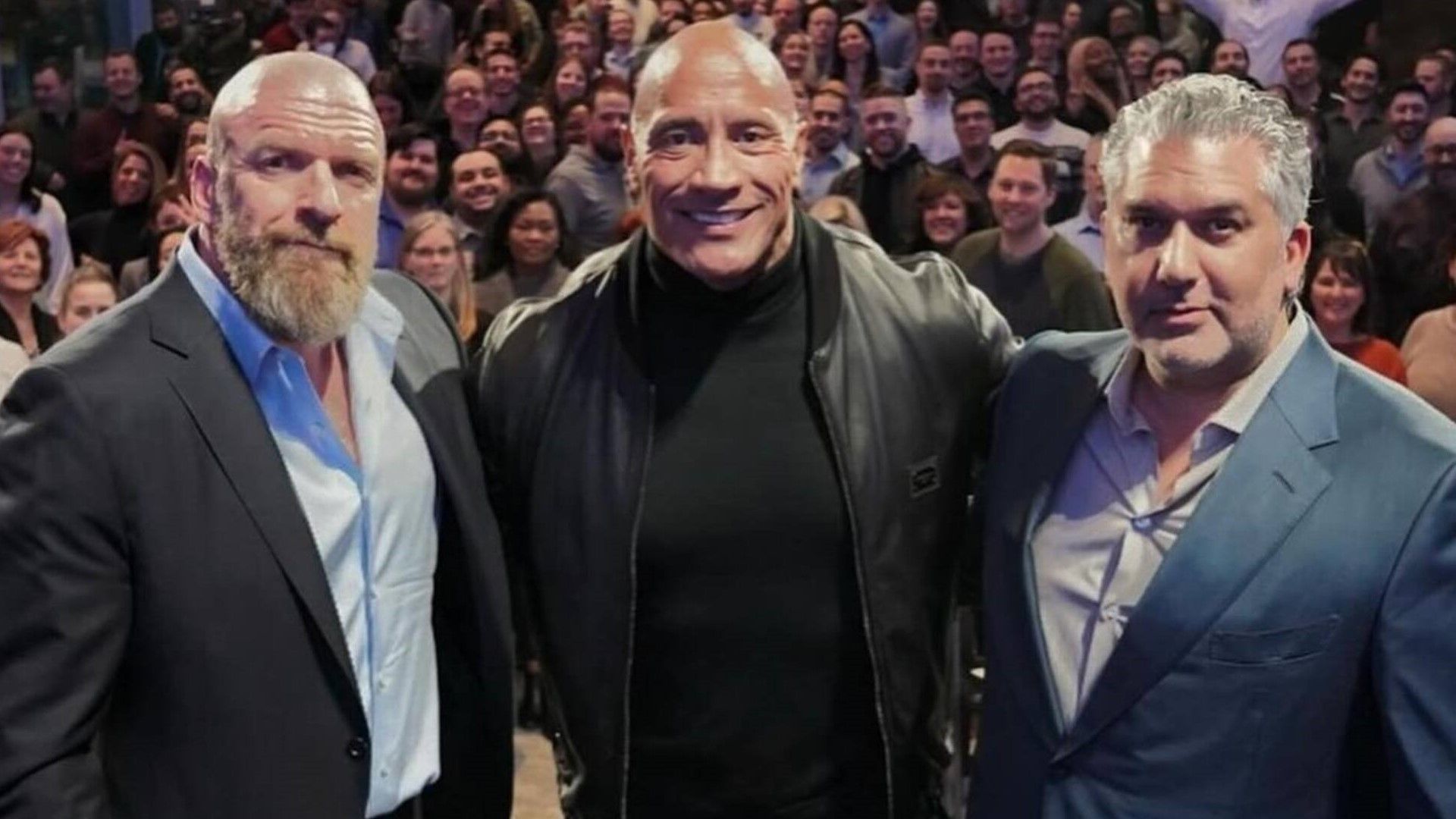 WWE officials Triple H, The Rock, and Nick Khan