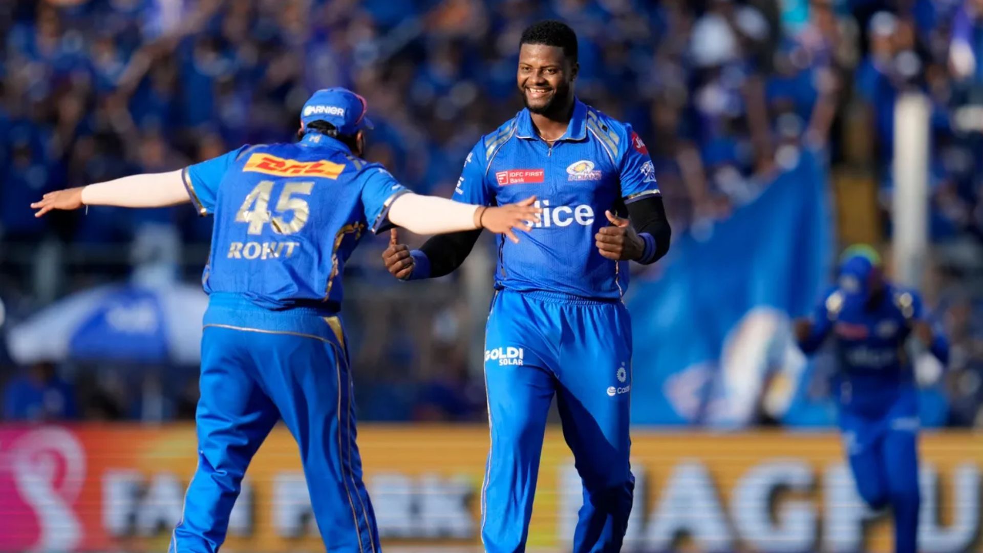 Romario Shepherd celebrating wicket with Rohit Sharma