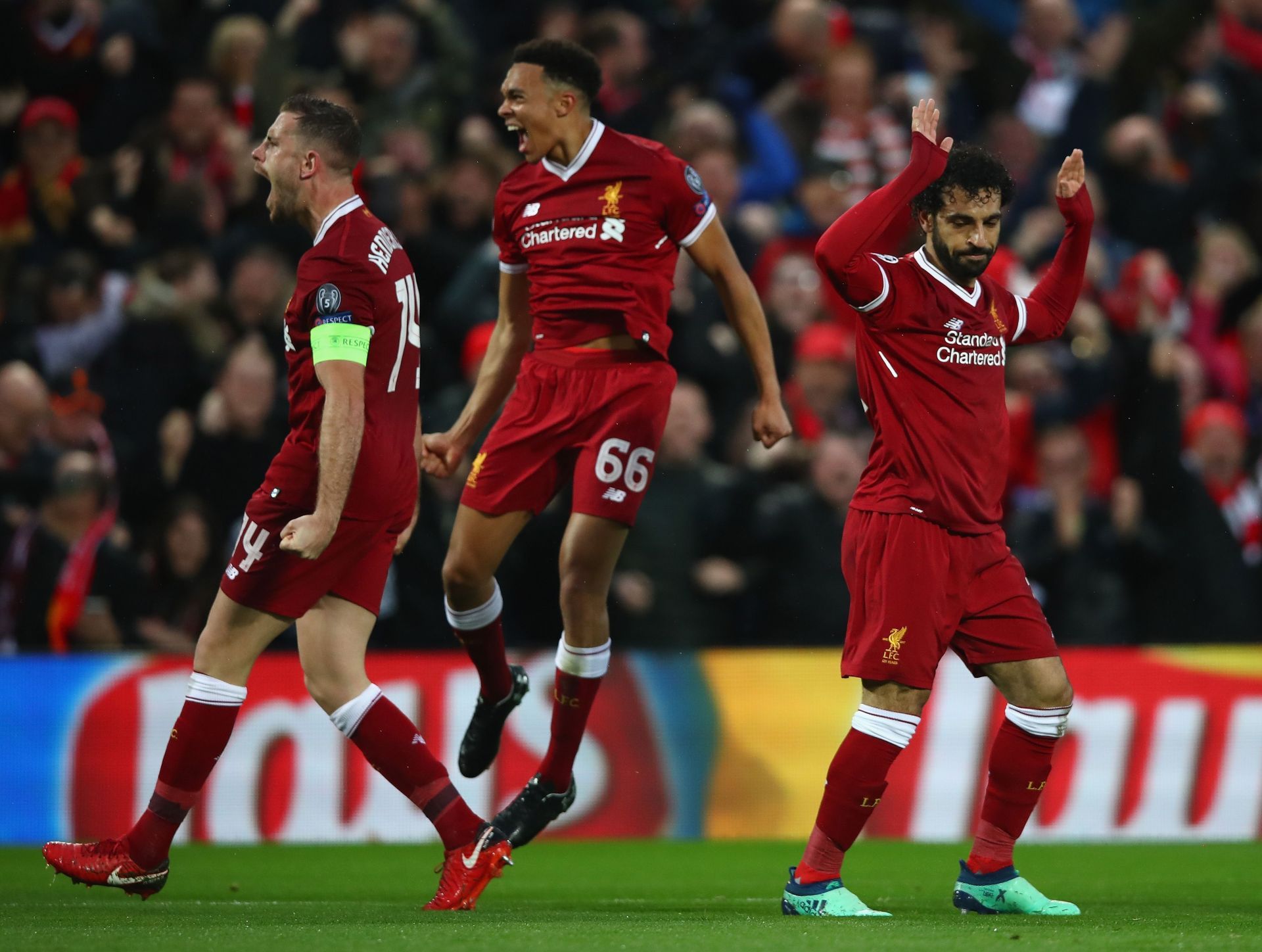 Jordan Henderson and Trent Alexander-Arnold celebrate after Salah&#039;s goal.