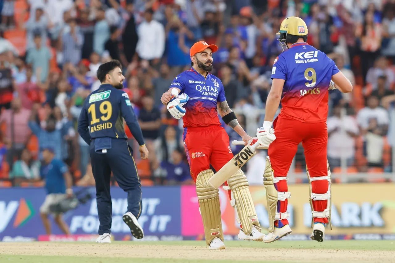 Rashid Khan (left) was taken to the cleaners by the RCB batters in Ahmedabad. [P/C: iplt20.com]