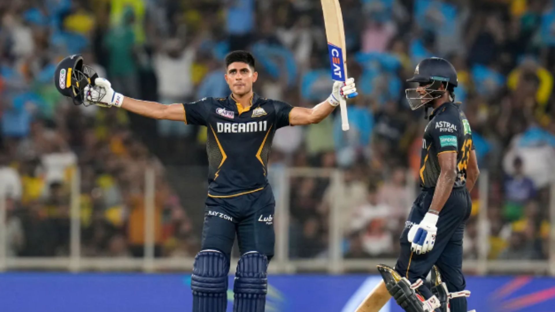 Shubman Gill raises his bat after scoring a century against CSK.