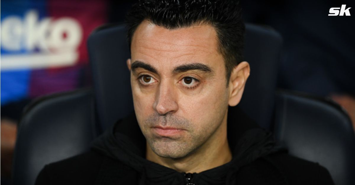 Barcelona boss Xavier Hernandez looks on.