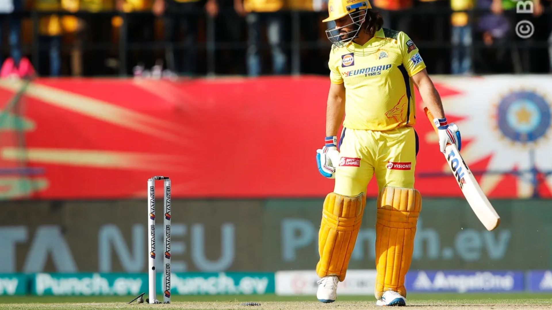 MS Dhoni looks on after being cleaned up by Harshal Patel on Sunday