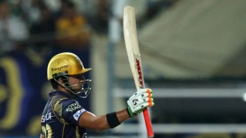 Gambhir raises his bat after scoring a half-century.