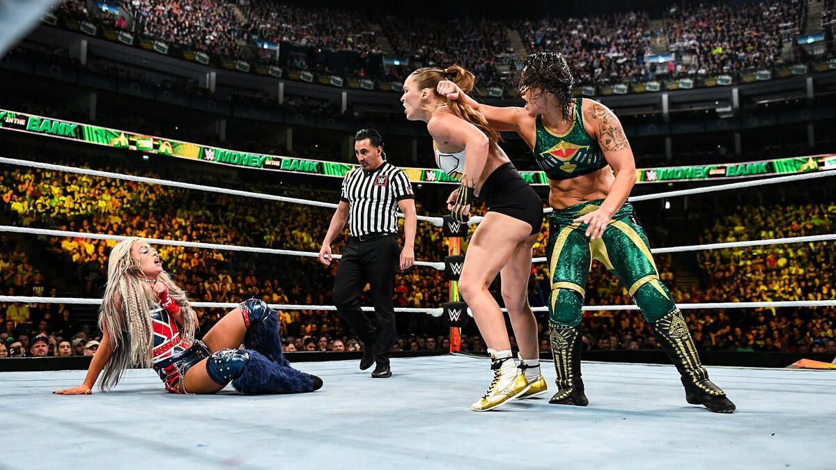 Liv Morgan (left) during her match with Shayna Baszler (right) and Ronda Rousey (right) (Photo credit: WWE.com)