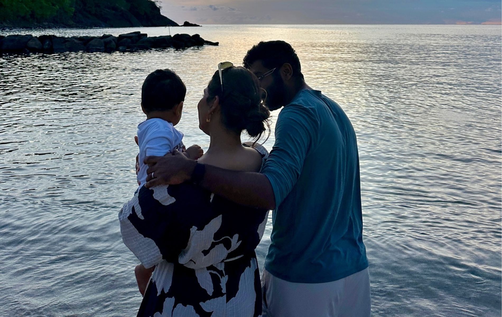 Jasprit Bumrah at a beach with his wife and son. 