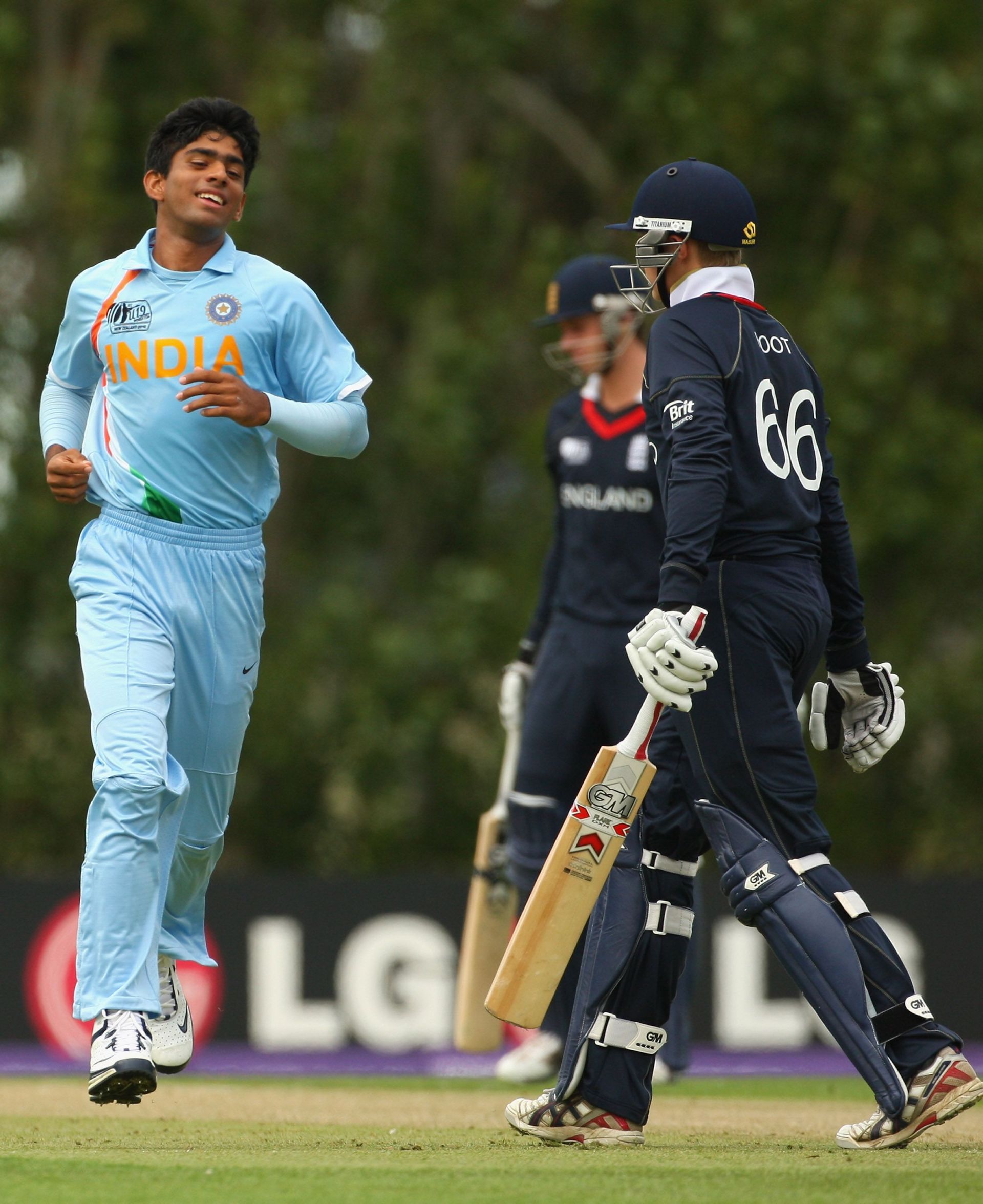 Saurabh Netravalkar of India celebrates his dismissal of Joe Root of England (R) during the ICC U19 Cricket World Cup match between India and England in 2010. (Photo by Phil Walter/Getty Images).