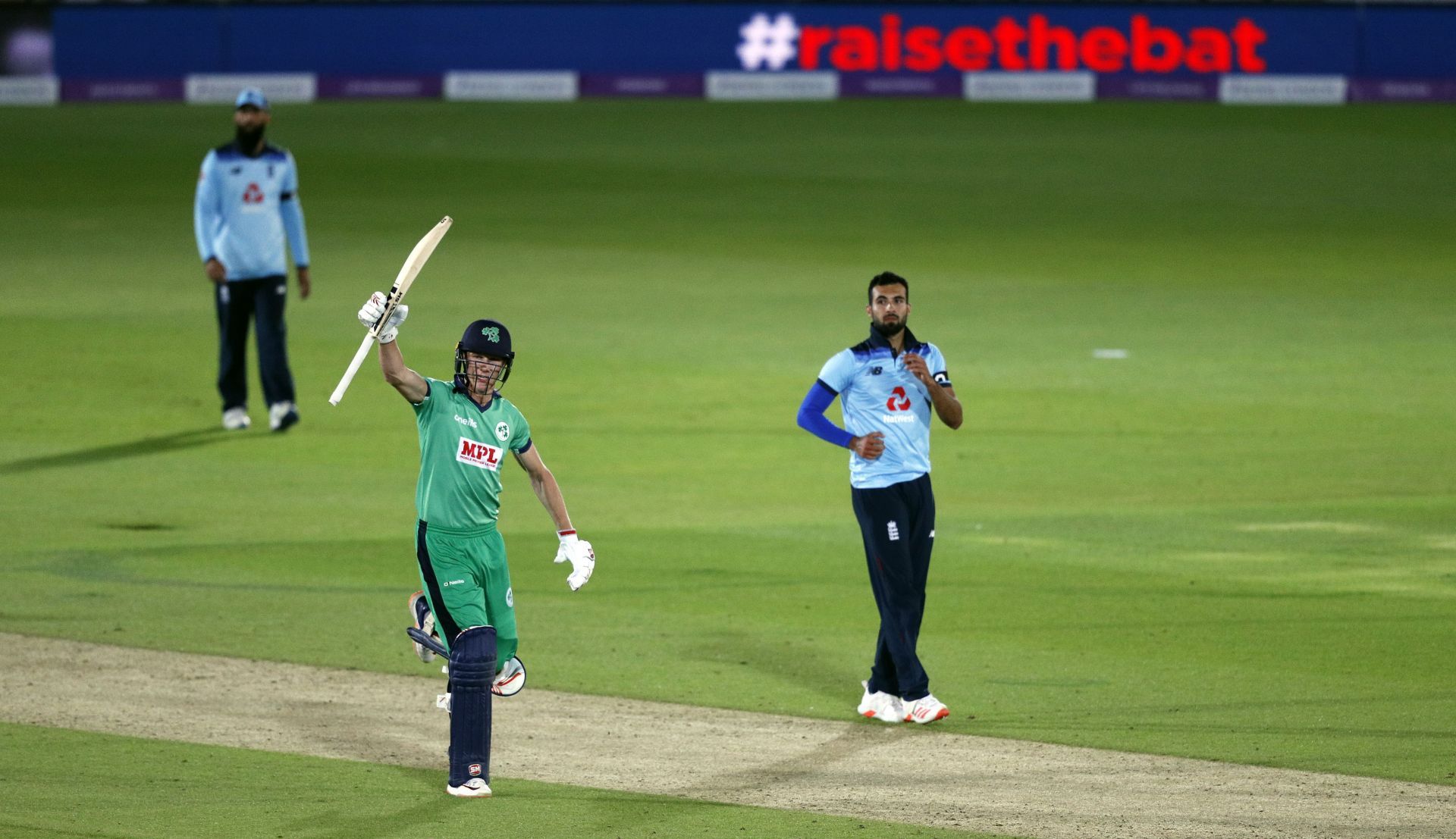 Harry Tector of Ireland celebrates victory watched on by Saqib Mahmood of England during the Third One Day International between England and Ireland in the Royal London Series at Ageas Bowl on August 04, 2020 in Southampton, England.