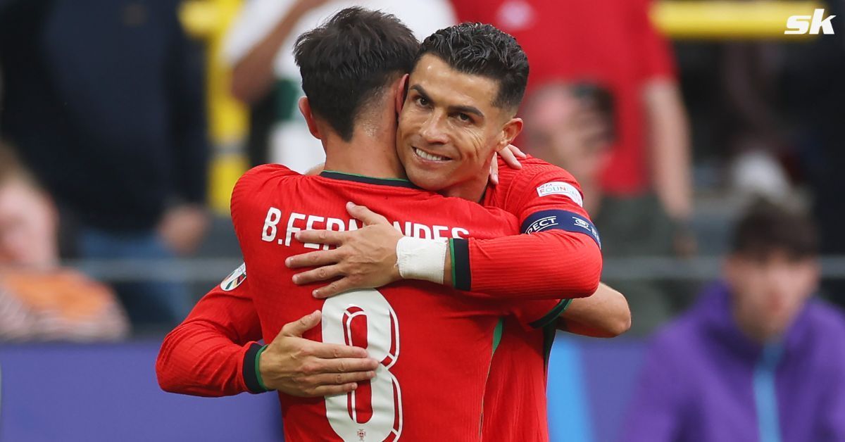 Portugal midfielder Bruno Fernandes embracing teammate Cristiano Ronaldo