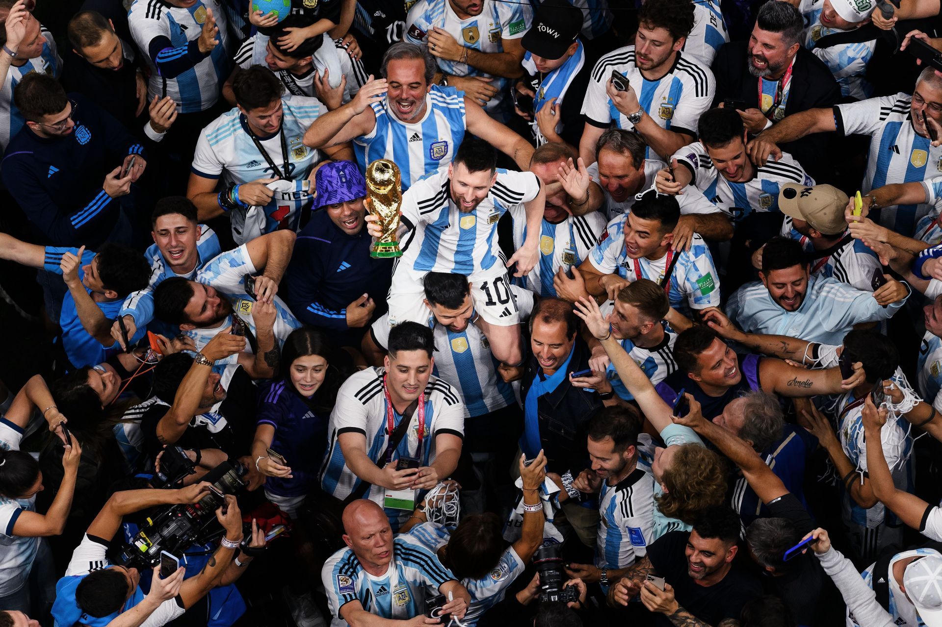 Lionel Messi sits on Sergio Aguero&#039;s shoulders after winning the World Cup.