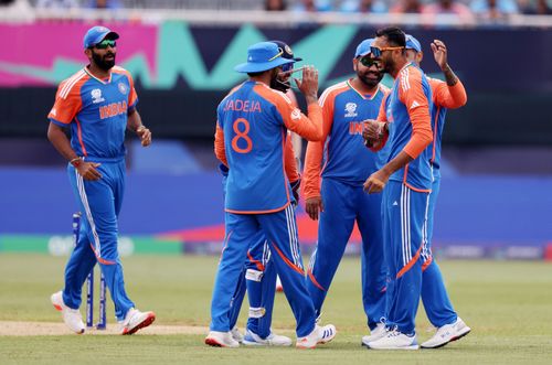 Axar Patel (right) dismissed Usman Khan with his first delivery.