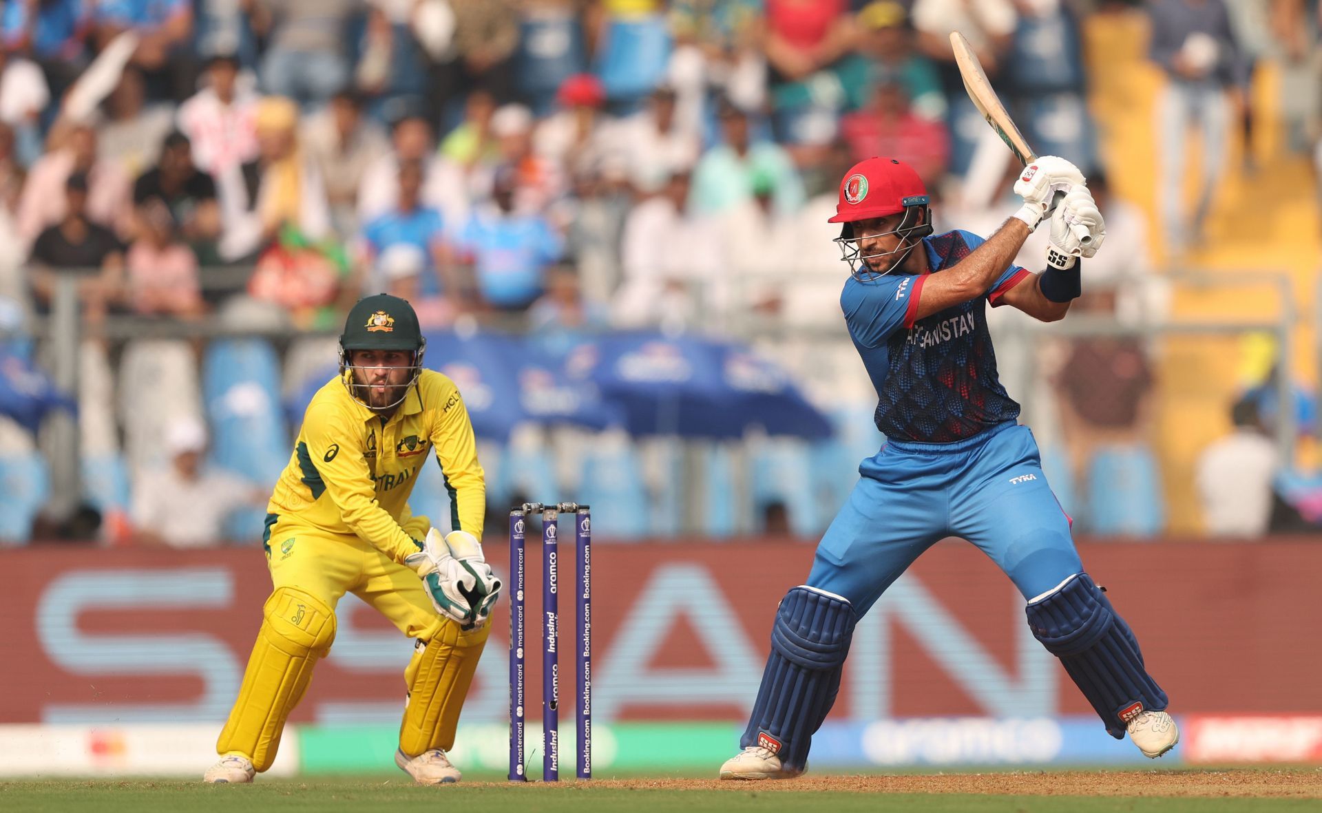 Rahmat Shah of Afghanistan plays a shot as Josh Inglis of Australia keeps during the ICC Men's Cricket World Cup India 2023 between Australia and Afghanistan at Wankhede Stadium on November 07, 2023 in Mumbai, India. (Photo by Robert Cianflone/Getty Images).