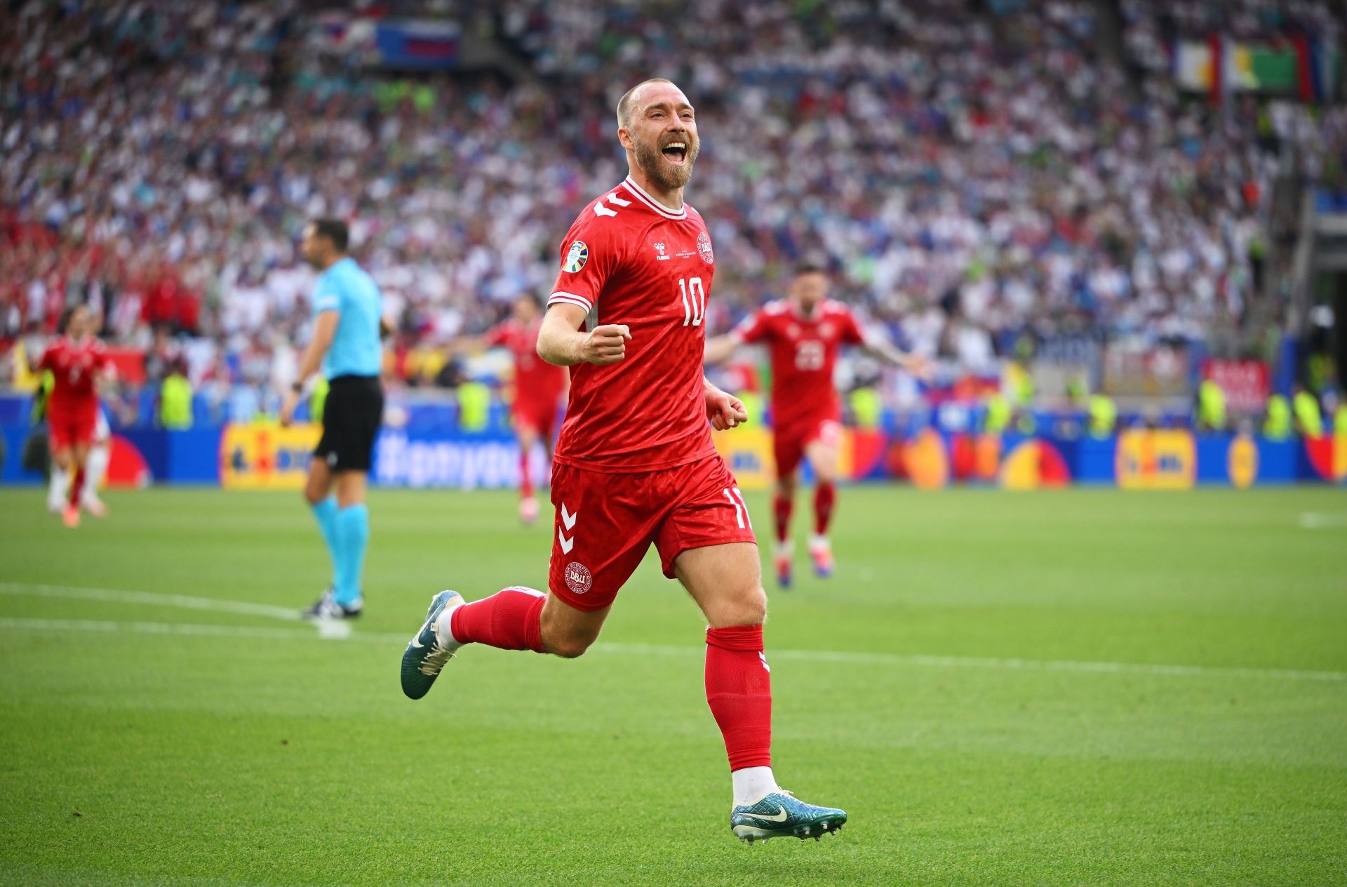 Christian Eriktsen rejoinces after scoring for Denmark.